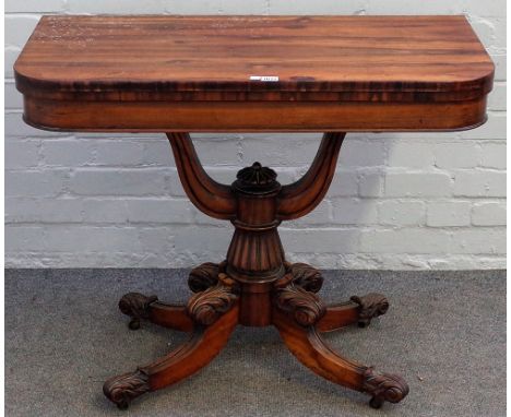 A Regency rosewood card table, the 'D' shaped top on open 'U' shaped mount and four scroll supports, 91cm wide x 73cm high.