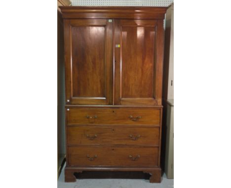 A late George III mahogany linen press with moulded panel doors over three long graduated drawers, 112cm wide x 194cm high. 