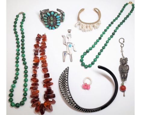 Two single row necklaces of graduated malachite beads, a reconstituted amber necklace, a colourless paste collar necklace, de