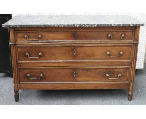 A 19th century French commode, the marble top over three long graduated drawers, on turned supports, 130cm wide x 81cm high.