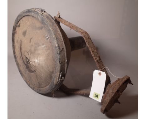 An early 20th century large pedestal lamp, possibly a nautical search light.
