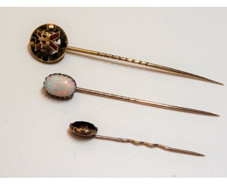 A Scottish gold and varicoloured agate stick pin, designed as The Cross of St Andrew with a crown, cased, an opal single ston