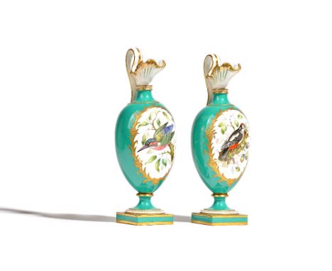 A pair of English porcelain green-ground ewers, 19th century, of Kedleston form, each painted with a panel of a bird in branc