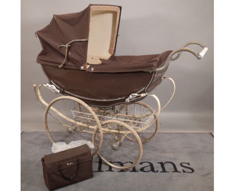 A mid-20th century 'Wilson' silver cross type childs pram, 130cm long x 40cm wide. 