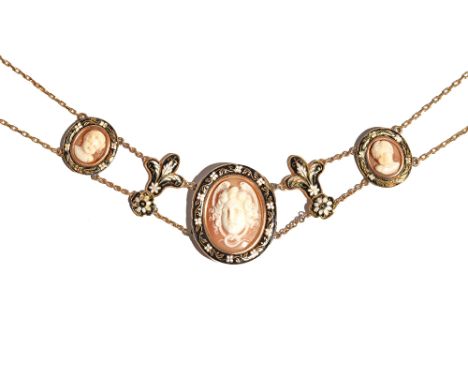 A gold, black and white enamelled and cameo necklace, the principal oval shell cameo carved as a Medusa head, within a black 