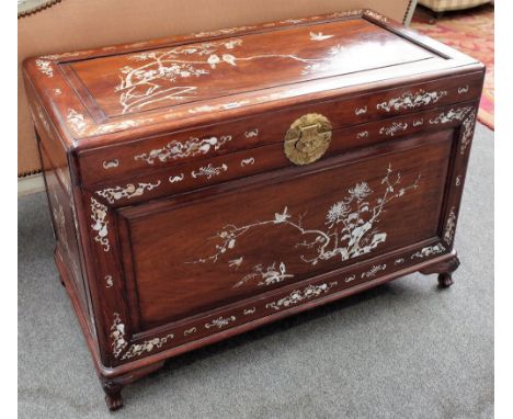 A 20th century mother-of-pearl inlaid Chinese rectangular hardwood lift top trunk, on squat cabriole supports, 102cm wide x 7