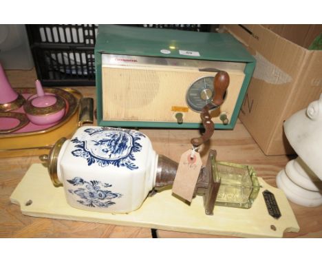 A 1950's / 60's Cossor radio and a blue and white Delft wall mounted coffee grinder.