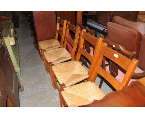 A Set of 4 rush seated ladder back kitchen chairs