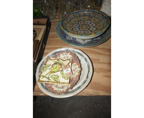 A French ceramic tile " Desvres" decorated with an exotic bird on a  flowering branch , other continental earthenware wall pl