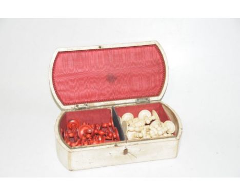 An early 20th Century Chess Set The full chess set with with half stained red and half natural bone, housed within a white pa