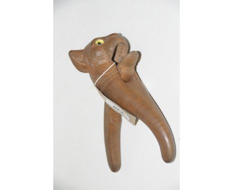 A novelty black forest type nutcracker in the form of a cat The carved wooden nutcrackers formed from a carved cat head exten