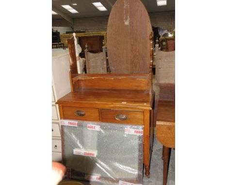 A Victorian satin walnut dressing table with a rectangular mirror above a shaped shelf, rectangular moulded top, two short an