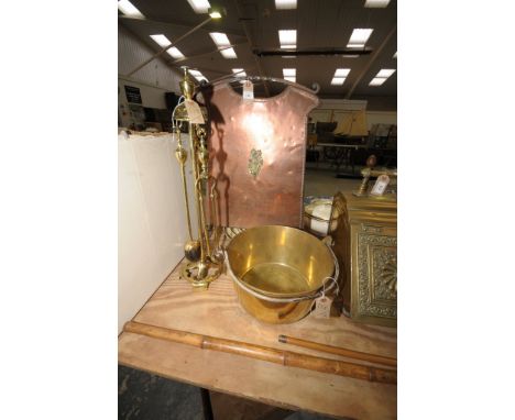 A Late 19th  / early 20th century copper and wrought iron firescreen centred with a brass musical instrument motif, a brass f