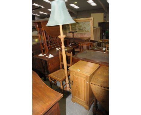 A Victorian ash single door pot cupboard , a rattan seated bedroom  chair and a lamp standard with three leaf carved down swe