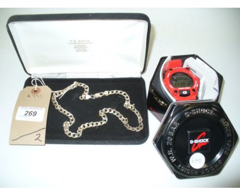 A 2015 Gents G Shock digital wrist watch and a gents silver bracelet. (2)
