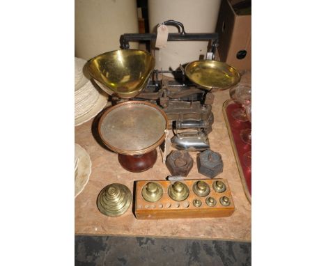 A Silver plated 3 bottle Tantalus frame , a set of French kitchen scales on a graduated kidney shaped plinth, a plate mounted