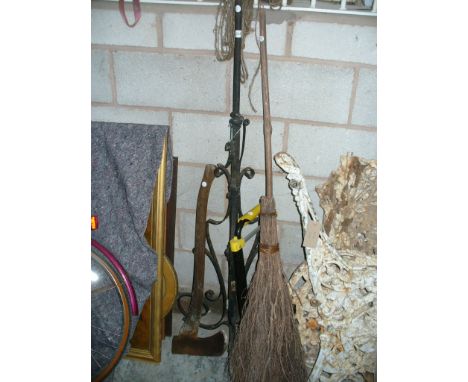 A Wrought iron lamp standard, axe,  broom and a trolley.(4)