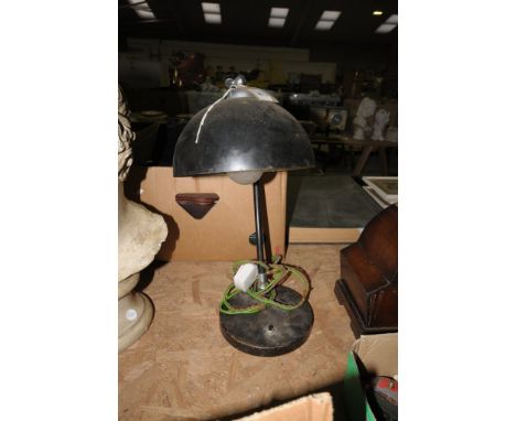An Early 20th century painted metal adjustable desk lamp.