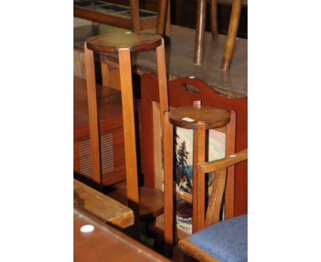 A Stained hardwood two tier circular plant stand , a smaller example and a painted firescreen. (3)