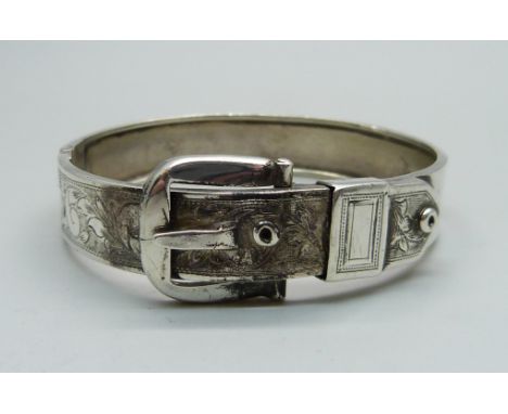 A white metal buckle bangle 