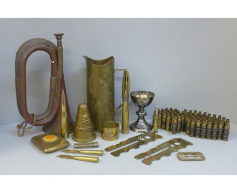 Militaria; a bugle, a brass trench art shell case, a Lancaster Division cigarette case, etc. 