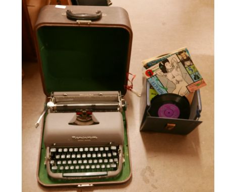 A Remington Quiet-Writer portable typewriter, cased and a box of 7" singles **PLEASE NOTE THIS LOT IS NOT ELIGIBLE FOR POSTIN
