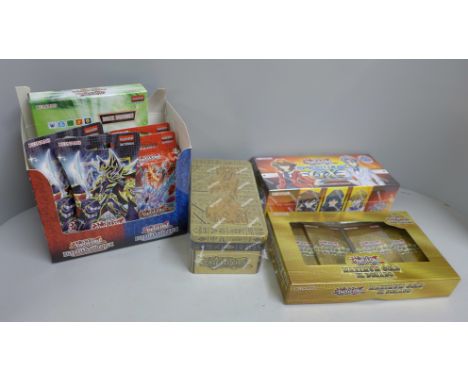 Sealed Yu-Gi-Oh cards:- a sealed Ancient Battles 2021 tin, a sealed Maximum Gold El Dorado 2020, a sealed first edition Hidde