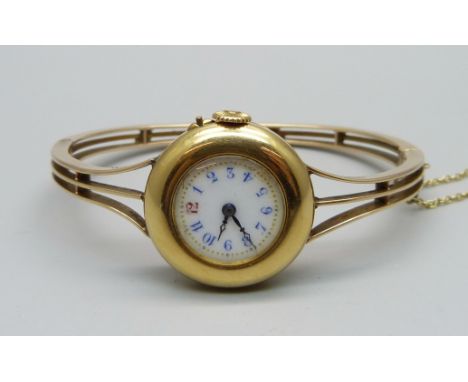 A lady's yellow metal wristwatch with yellow metal bangle strap, 27.8g gross weight 