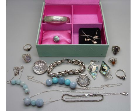 Silver jewellery including a bangle, two bracelets, a brooch, rings, etc. 