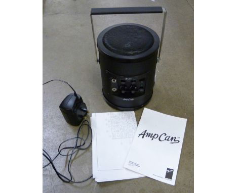 A Fender 'Amp Can' classic portable battery amp, first year of production 1997 with owner's manual and original Fender mains 