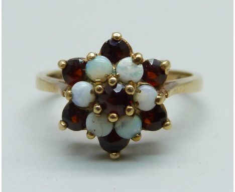 A 9ct gold, opal and garnet cluster ring, 2.7g, M 