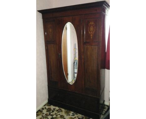 Edwardian mahogany wardrobe with oval mirror door