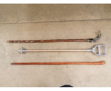 A horn handled walking cane, a shooting stick and one other