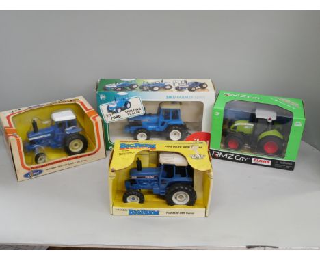 Four model tractors; two by Ertl, one Siku and one RMZ City