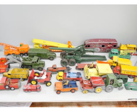 A collection of die-cast model vehicles including Matchbox and Dinky, playworn