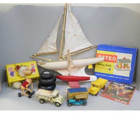 A collection of toys including Dinky trucks, a Pelham puppet, a pond yacht, Pan-Am Boeing 747, etc. **PLEASE NOTE THIS LOT IS