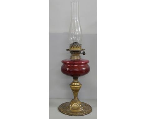A Hicks oil lamp with brass base, late 19th early 20th Century