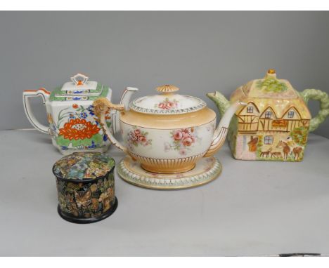 An English Staffordshire cottage teapot, a Mason's Ironstone teapot, English teapot and stand and a also small lacquered trin