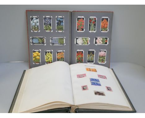 A stamp album and Player's cigarette cards album 