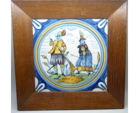 An antique polychrome Delft majolica medallion tile, provenance on reverse