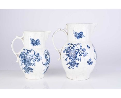 Two Caughley porcelain 'Bouquets' cabbage leaf maskhead jugs, circa 1785, transfer-printed in underglaze blue, printed S and 