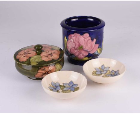 A small group of Moorcroft pottery, comprising a green 'Hibiscus' circular powder jar and cover, Potters to Late Queen Mary p