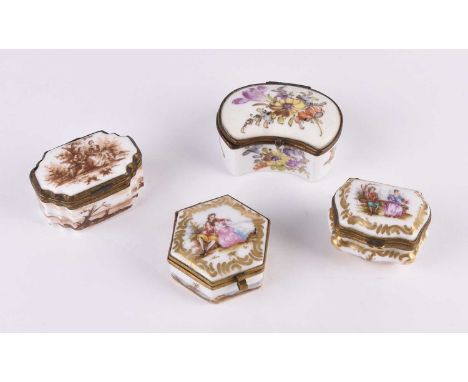 A group of four German porcelain patch or trinket boxes, 19th century, including an example with flowers, two polychrome with
