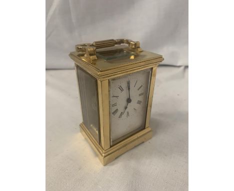 A SMALL CARRIAGE CLOCK 