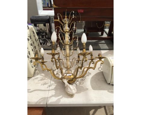 A DECORATIVE GILT CEILING LIGHT FITTING 