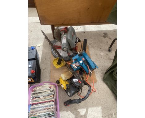 AN ASSORTMENT OF TOOLS TO INCLUDE A PETROL HEDGE CUTTER, MITRE SAW AND A CIRCULAR SAW 