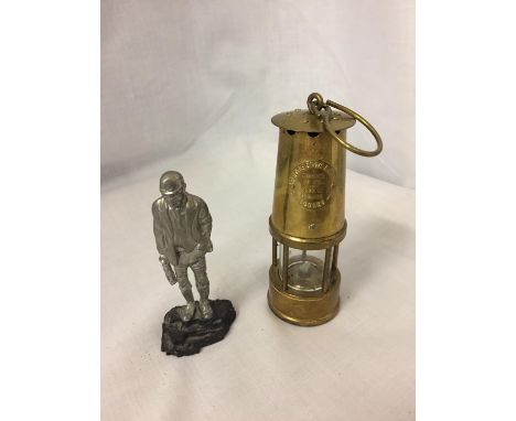 A BRASS MINATURE MINERS PROTECTION LAMP ECCLES AND A FIGURE OF A MINER 