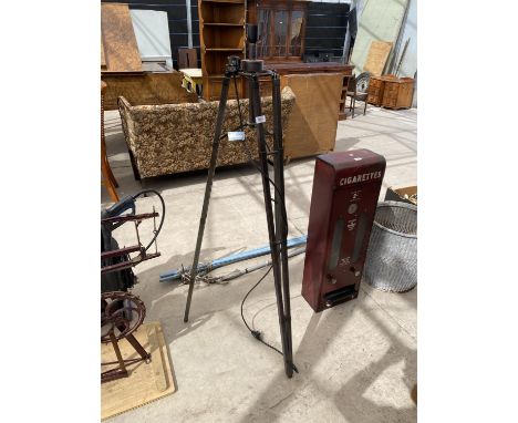 AN INDUSTRIAL STYLE STANDARD LAMP WITH TRIPOD BASE 