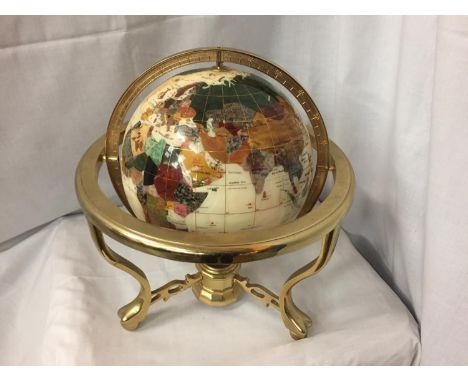 A GEM STONE AND PEARLISED GLOBE ON BRASS STAND32CM HIGH 