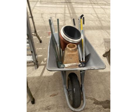 A WHEEL BARROW AND AN ASSORTMENT OF GARDEN TOOLS 